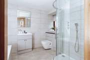 Bedroom 2 has a large en suite with a separate shower enclosure.