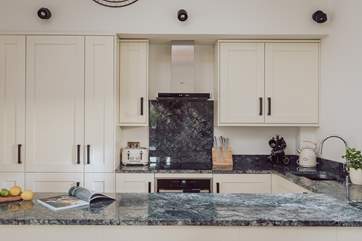 The stylish kitchen has all you need to conjure up your culinary delights.