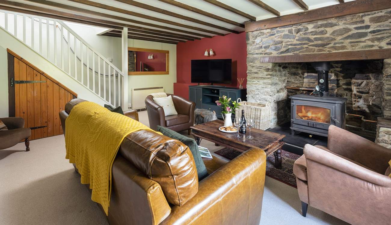 The stairs link up into the first floor from the cosy sitting-room.