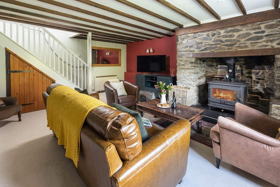 The stairs link up into the first floor from the cosy sitting-room.