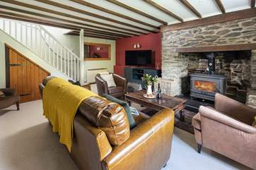 The stairs link up into the first floor from the cosy sitting-room.