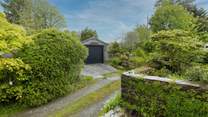 From your doorstep, looking over to the garage and the access to the garden.