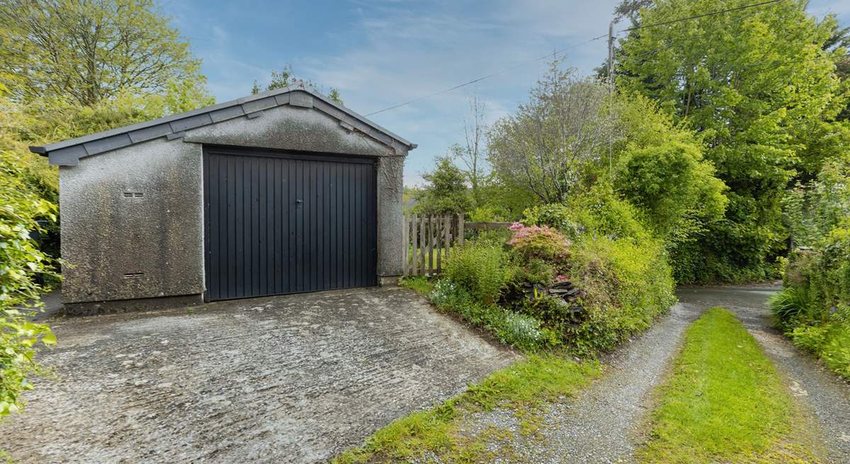 Your garage and sloped parking. Note, the driveway and parking space are recommended for small to medium cars only (due to the width of the approach and space).