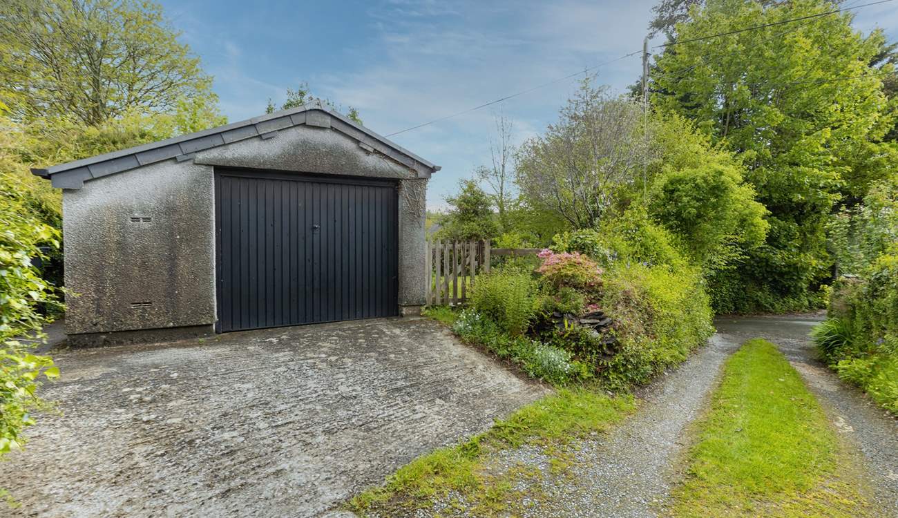 Your garage and sloped parking. Note, the driveway and parking space are recommended for small to medium cars only (due to the width of the approach and space).