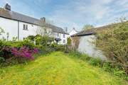 Looking back at the cottage from your private garden.