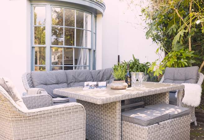 Relax in the pretty front garden.