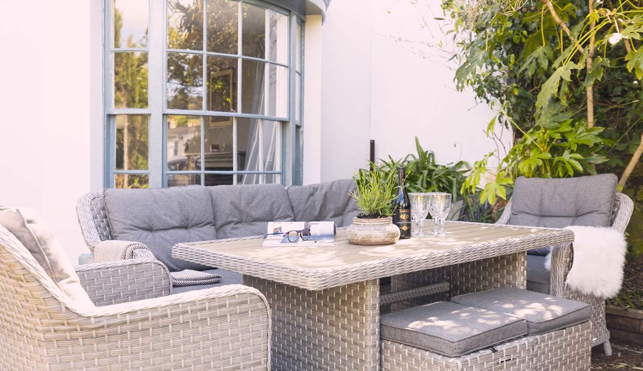 Relax in the pretty front garden.