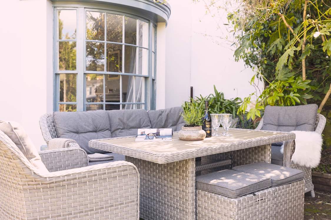 Relax in the pretty front garden.