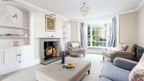 Decorated in relaxing pastel shades, the sitting-room is heavenly.