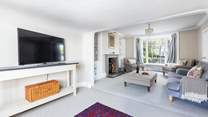 The main sitting-room offers oodles of space and comfort. The perfect place to gather together in the evening.
