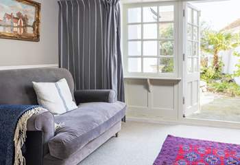 The patio doors lead out into the quiet back garden so you can let the outside in.