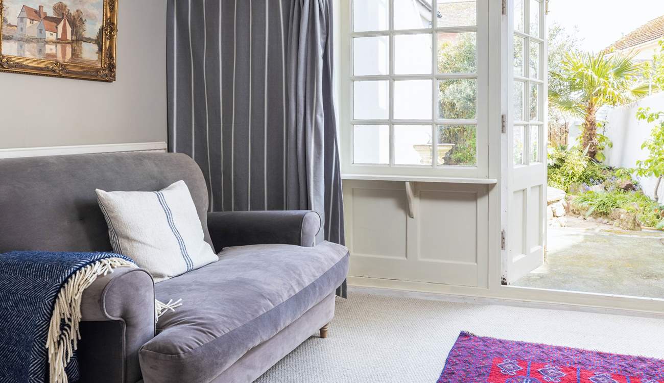 The patio doors lead out into the quiet back garden so you can let the outside in.