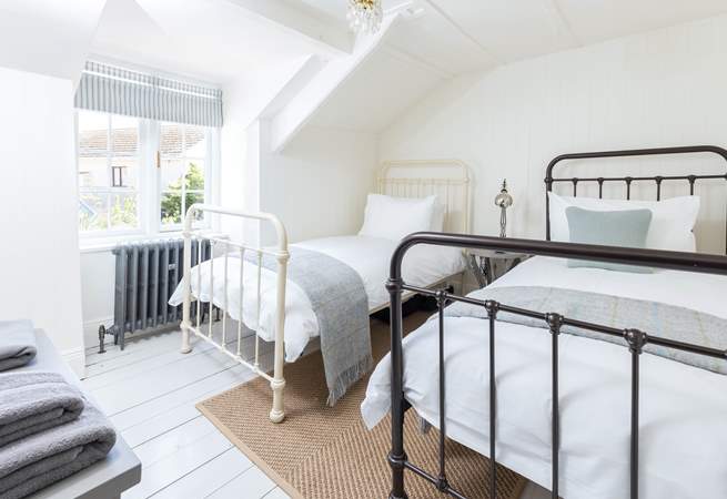 The twin bedroom is relaxing and light-filled.
