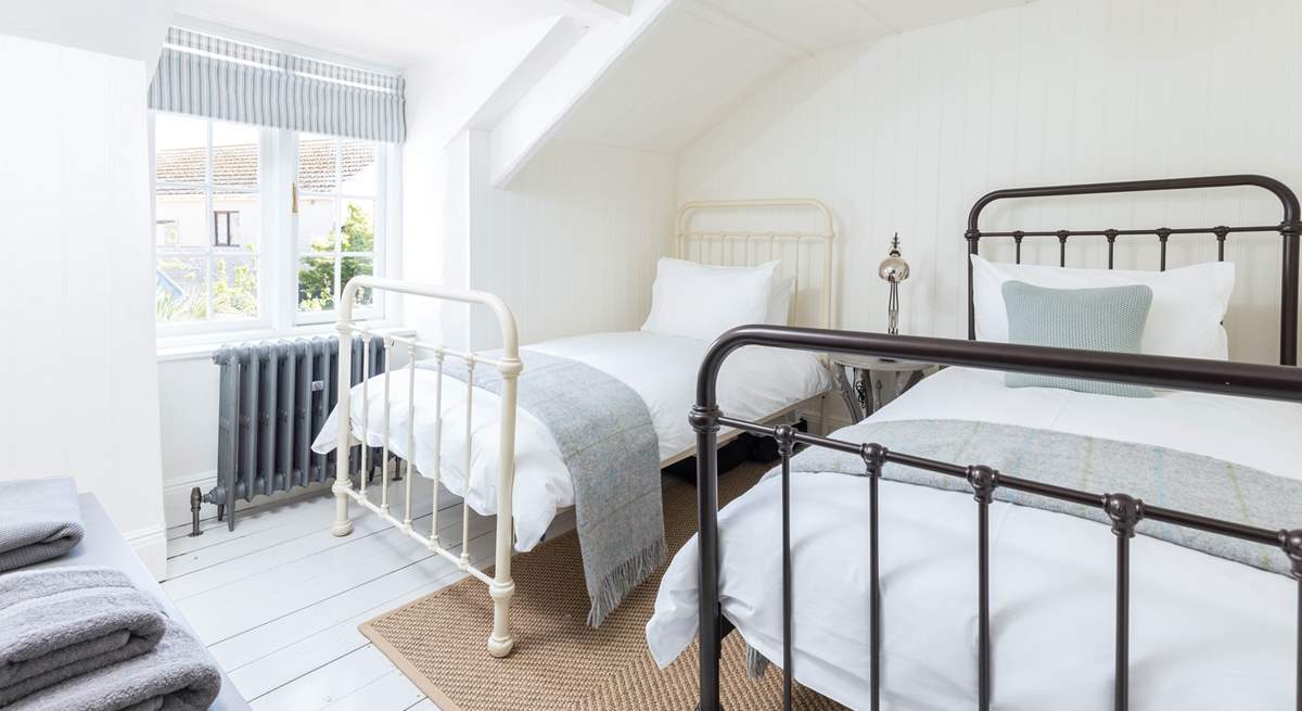 The twin bedroom is relaxing and light-filled.