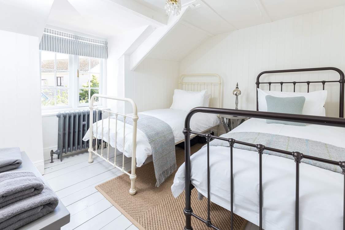 The twin bedroom is relaxing and light-filled.