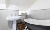 The family bathroom has a luxurious roll-top bath, a great way to relax after a day out exploring. - Thumbnail Image