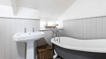 The family bathroom has a luxurious roll-top bath, a great way to relax after a day out exploring.