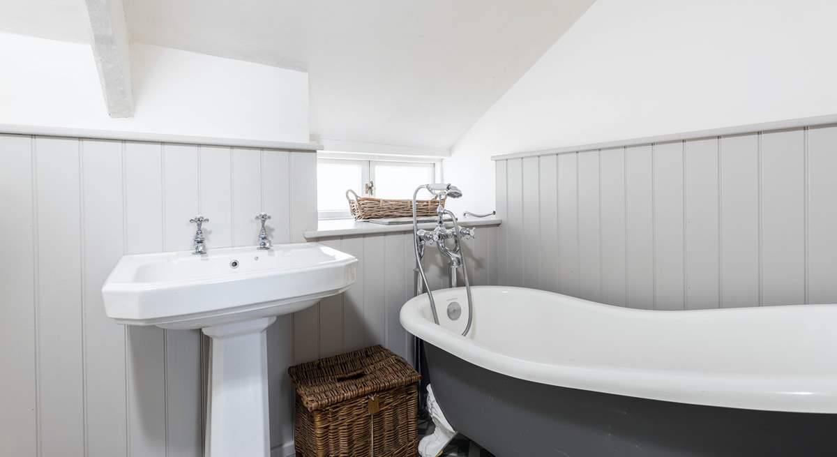 The family bathroom has a luxurious roll-top bath, a great way to relax after a day out exploring.