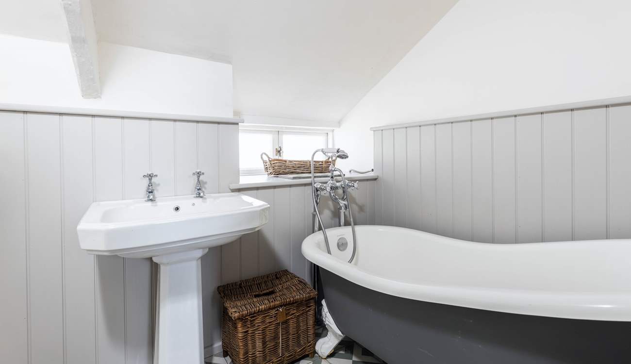The family bathroom has a luxurious roll-top bath, a great way to relax after a day out exploring.