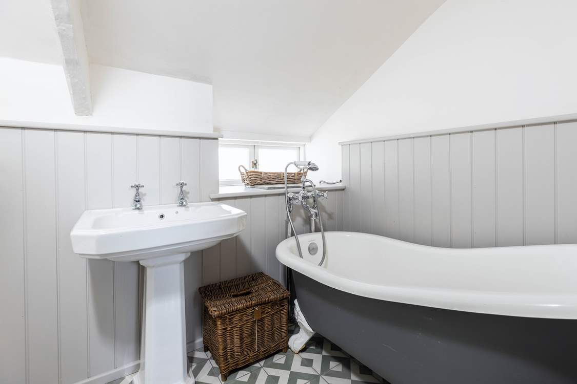 The family bathroom has a luxurious roll-top bath, a great way to relax after a day out exploring.