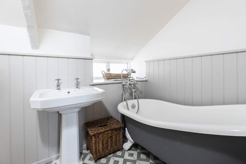The family bathroom has a luxurious roll-top bath, a great way to relax after a day out exploring.
