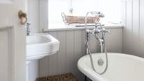 There is a useful hand shower attachment over the roll-top bath.