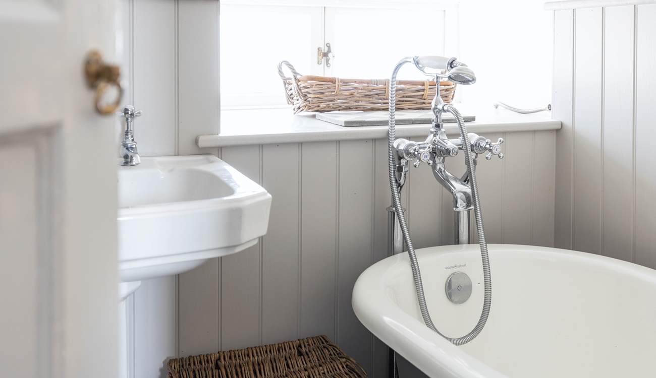 There is a useful hand shower attachment over the roll-top bath.