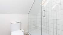 The family shower-room is home to this large walk-in shower, which is perfect after a day on the beach.