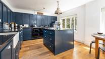 The contemporary kitchen has everything you'll need to cook up a feast.