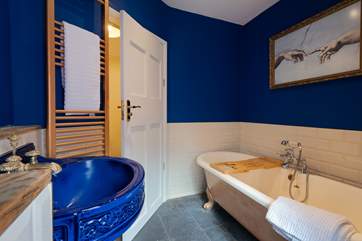 The bathroom complete with roll-top bath.