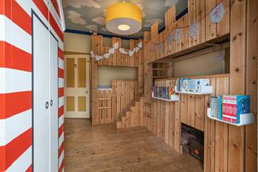 The fantastic kids room with fort style bunk-beds, the little ones may never want to go out!