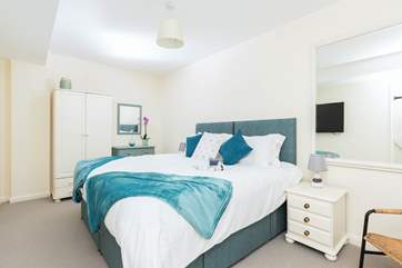 Bedroom one has a 'zip and link' super-king double or twin beds, a TV and an en suite bathroom. Perfect!