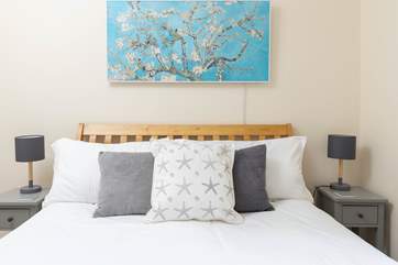 Bedroom three on the ground floor has a king-size bed and en suite shower-room.