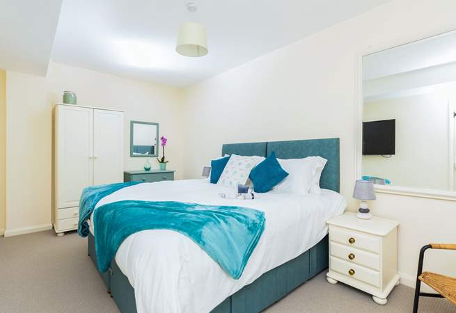 Bedroom one has a 'zip and link' super-king double or twin beds, a TV and an en suite bathroom. Perfect!