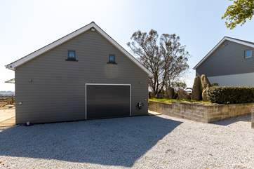 The Neyth is on the first floor of this building. The owners who live on site, don't use the garage but the horses can occasionally be found in the stables.
