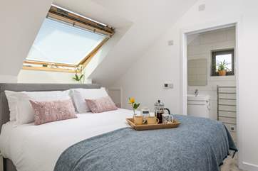 The main bedroom is decorated in calming soft tones (please take care not to knock your head on the sloping ceiling).