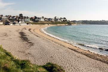 Gyllyngvase beach in Falmouth is a safe, sandy beach with seasonal life guards, café, restaurant and paddle board hire.