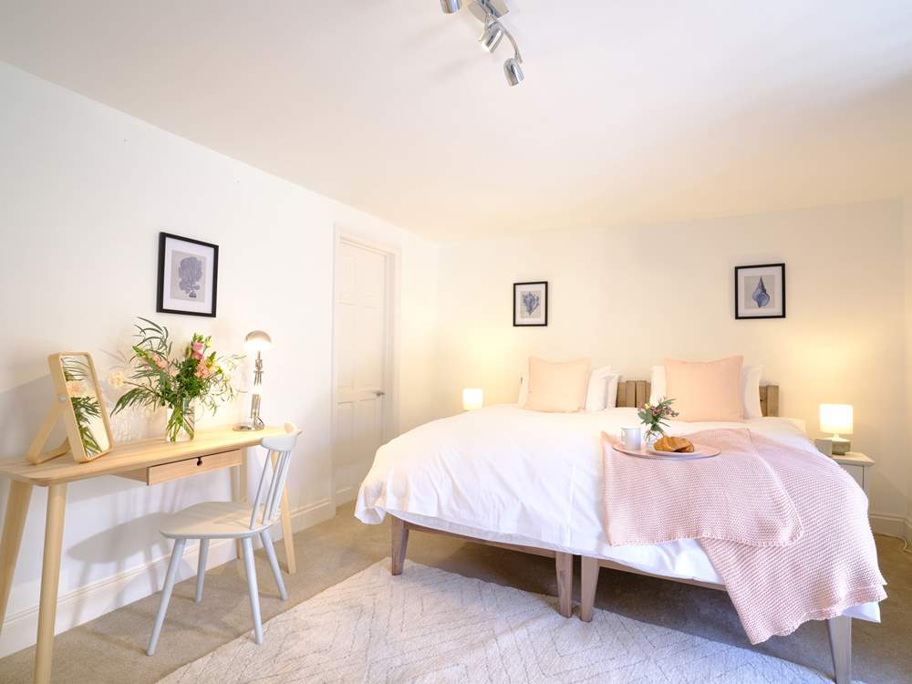 The pretty main bedroom can be a twin or double bedroom.