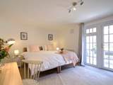 This spacious bedroom has the added benefit of an en suite shower-room.