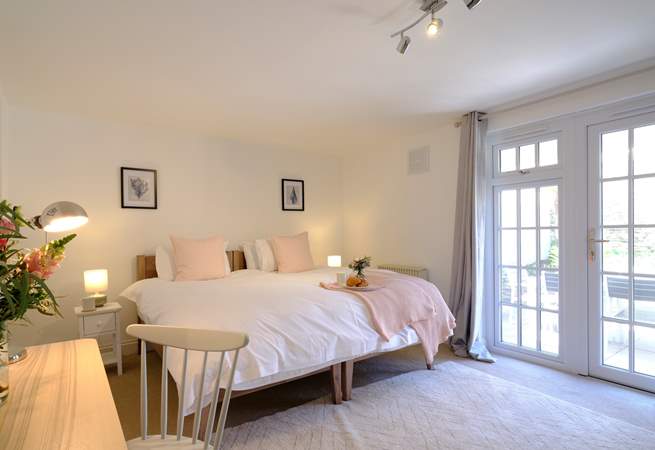 This spacious bedroom has the added benefit of an en suite shower-room.