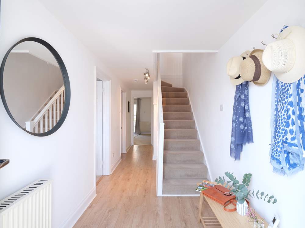 The welcoming hallway leading to bedrooms 1 and 2.