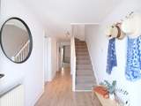 The welcoming hallway leading to bedrooms 1 and 2.