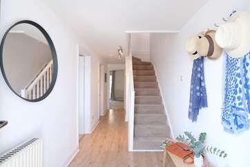 The welcoming hallway leading to bedrooms 1 and 2.