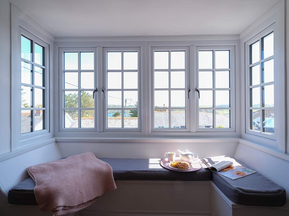 Sit back and enjoy the wonderful window seat in the living-room.