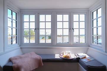 Sit back and enjoy the wonderful window seat in the living-room.