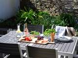 The secluded patio is the perfect place for outside dining.