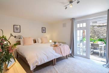 The delightful en suite bedroom on the ground floor with secluded patio.