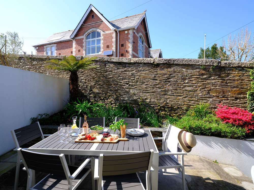 The outside patio is a lovely place to sit and enjoy outside space.