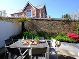 The outside patio is a lovely place to sit and enjoy outside space.