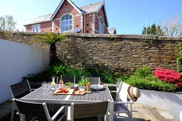 The outside patio is a lovely place to sit and enjoy outside space.
